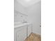 The Laundry Room features a full sized washer and dryer along with storage shelving at 1573 Eastern Sunrise Ln, Decatur, GA 30034