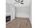 Living room showcases wood-look floors and a cozy fireplace at 1573 Eastern Sunrise Ln, Decatur, GA 30034