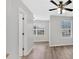 Light and airy living room featuring large windows and hardwood flooring at 1573 Eastern Sunrise Ln, Decatur, GA 30034
