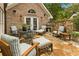 Charming stone patio with ample seating and built-in brick outdoor fireplace, perfect for entertaining at 1993 Mount Vernon Pl, Dunwoody, GA 30338