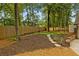 Lovely backyard with a manicured lawn, a putting green, and a privacy fence at 1993 Mount Vernon Pl, Dunwoody, GA 30338