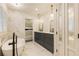 A spacious bathroom features a soaking tub and double marble vanity with access to bedroom at 1993 Mount Vernon Pl, Dunwoody, GA 30338