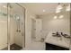 Bathroom features a tile shower, double sink vanity, and bright lighting at 1993 Mount Vernon Pl, Dunwoody, GA 30338