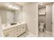 Bathroom with double sinks, white cabinets, and a separate toilet room at 1993 Mount Vernon Pl, Dunwoody, GA 30338