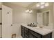 Bathroom featuring double sinks, granite counters, decorative lighting and a large mirror at 1993 Mount Vernon Pl, Dunwoody, GA 30338