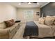 Bedroom featuring a couch, carpet, and grey accent wall at 1993 Mount Vernon Pl, Dunwoody, GA 30338