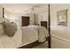Cozy bedroom featuring a four-poster bed, carpeted floor, and neutral color scheme at 1993 Mount Vernon Pl, Dunwoody, GA 30338