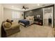 Bedroom featuring a couch, carpet, and grey accent wall at 1993 Mount Vernon Pl, Dunwoody, GA 30338