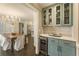 Charming dining area featuring a classic chandelier, light-blue cabinets, and easy access to the kitchen at 1993 Mount Vernon Pl, Dunwoody, GA 30338