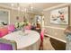 Bright dining room with stylish pink chairs, chandelier, and elegant decor at 1993 Mount Vernon Pl, Dunwoody, GA 30338