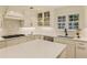 Bright kitchen with white cabinets, stainless steel appliances, subway tile backsplash, and large island at 1993 Mount Vernon Pl, Dunwoody, GA 30338