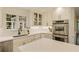 Bright kitchen with white cabinets, stainless steel appliances, and a view from over the sink at 1993 Mount Vernon Pl, Dunwoody, GA 30338