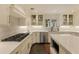 Bright kitchen with white cabinets, stainless steel appliances, subway tile backsplash, and large island at 1993 Mount Vernon Pl, Dunwoody, GA 30338