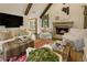 Vaulted living room boasts a stone fireplace, beamed ceilings, and hardwood floors at 1993 Mount Vernon Pl, Dunwoody, GA 30338
