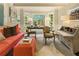Cozy living area with colorful wallpaper, comfortable seating, and lots of natural light from large windows at 1993 Mount Vernon Pl, Dunwoody, GA 30338