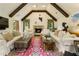 Bright living room features vaulted ceiling, stone fireplace, and white sofas at 1993 Mount Vernon Pl, Dunwoody, GA 30338