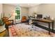 Office with wooden desk, arched window, and chairs at 1993 Mount Vernon Pl, Dunwoody, GA 30338