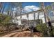 Back of home featuring a deck and a two-story white exterior at 325 Upper Creek Ct, Roswell, GA 30076