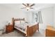 Cozy bedroom featuring neutral walls, carpet, a ceiling fan, and a bed with a wooden frame at 325 Upper Creek Ct, Roswell, GA 30076