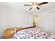 Bedroom featuring neutral walls, carpet, a ceiling fan, and a bed with a wooden frame at 325 Upper Creek Ct, Roswell, GA 30076