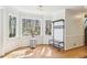 Charming breakfast nook with large windows, wood floors, and a view of the backyard at 325 Upper Creek Ct, Roswell, GA 30076