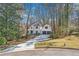 Two story home featuring white siding and a two car garage at 325 Upper Creek Ct, Roswell, GA 30076
