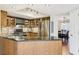 Well-equipped kitchen featuring stainless steel appliances, granite countertops, and wood cabinets at 325 Upper Creek Ct, Roswell, GA 30076