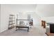 Spacious living room featuring neutral walls, carpet, a coffee table and comfortable seating at 325 Upper Creek Ct, Roswell, GA 30076