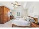 Vaulted ceiling, ample furniture, and large windows can be found in this main bedroom at 325 Upper Creek Ct, Roswell, GA 30076