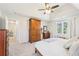 Comfortable main bedroom features a tray ceiling, neutral carpet, and matching furniture at 325 Upper Creek Ct, Roswell, GA 30076