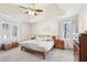 Bright main bedroom with large windows, carpet, and lots of closet space at 325 Upper Creek Ct, Roswell, GA 30076