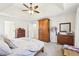 Spacious main bedroom with hardwood furniture, neutral carpet, and tray ceiling at 325 Upper Creek Ct, Roswell, GA 30076