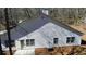 Back exterior view with a door, multiple windows, siding, and AC unit at 359 Cannongate Rd, Sharpsburg, GA 30277