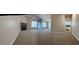 Expansive living room featuring a fireplace, neutral colors and abundant natural light at 359 Cannongate Rd, Sharpsburg, GA 30277