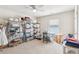 Bright bonus room with ample storage, featuring built-in shelving and a ceiling fan at 4645 Dandelion Way, Cumming, GA 30040