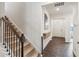 Inviting entryway featuring hardwood floors, staircase, and natural light at 4645 Dandelion Way, Cumming, GA 30040