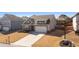 Charming home featuring a two-car garage, well-manicured lawn, and neutral exterior paint at 4645 Dandelion Way, Cumming, GA 30040