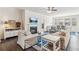 Inviting living room with cozy fireplace, plush seating, and stylish decor with open floorplan to the dining room at 4645 Dandelion Way, Cumming, GA 30040
