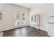 Bright, airy space with hardwood floors, white walls, a glass door to a patio, and built-in glass shelving at 4645 Dandelion Way, Cumming, GA 30040