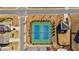 Aerial view of two green and blue tennis courts next to community buildings at 4645 Dandelion Way, Cumming, GA 30040