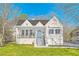 Charming white home with a lovely front porch and a well-manicured lawn at 1337 M L King Jr Nw Dr, Atlanta, GA 30314