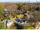 An aerial view showcases a home nestled among mature trees in a charming neighborhood with views of the city at 1337 M L King Jr Nw Dr, Atlanta, GA 30314