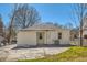 Back of house with a concrete backyard, a small grass area, and an A/C unit at 1337 M L King Jr Nw Dr, Atlanta, GA 30314