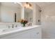 Bathroom showcasing a double vanity with sinks, mirrors, modern lighting, and a luxurious walk-in shower at 1337 M L King Jr Nw Dr, Atlanta, GA 30314