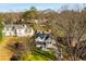 A home exterior with a welcoming front porch is surrounded by a well-manicured yard and mature trees at 1337 M L King Jr Nw Dr, Atlanta, GA 30314