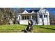 Charming renovated home featuring a well-manicured lawn and a welcoming light-blue front door at 1337 M L King Jr Nw Dr, Atlanta, GA 30314