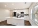 Updated kitchen with white cabinets, an island, and stainless steel refrigerator at 1337 M L King Jr Nw Dr, Atlanta, GA 30314