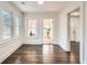Bright living room featuring hardwood floors, natural light from multiple windows and view into another room at 1337 M L King Jr Nw Dr, Atlanta, GA 30314