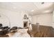 Bright living room with hardwood floors, fireplace, and elegant coffered ceiling at 1337 M L King Jr Nw Dr, Atlanta, GA 30314