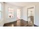 Hardwood floors in a bright living room with multiple windows, plus view into another room at 1337 M L King Jr Nw Dr, Atlanta, GA 30314